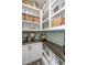 Walk-in pantry featuring open shelves, baskets, tiled walls, wood counter, and bulk food dispensers at 204 Torslanda Ln, Summerville, SC 29486