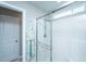 Shower enclosure featuring glass doors, bright white tile, and modern fixtures at 204 Torslanda Ln, Summerville, SC 29486