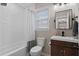 Well-lit bathroom with modern fixtures and a bathtub with shower at 208 James St, Summerville, SC 29483