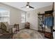 Bright bedroom featuring windows, a ceiling fan, and stylish decor at 208 James St, Summerville, SC 29483