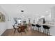 Contemporary kitchen with a dining area, sleek bar stools, and modern lighting at 208 James St, Summerville, SC 29483