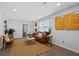Cozy living room featuring a comfortable sofa, stylish decor, and ample natural light at 208 James St, Summerville, SC 29483