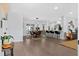 Open-concept living space featuring hardwood floors, a dining area, and modern decor at 208 James St, Summerville, SC 29483
