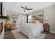 Charming main bedroom with ensuite bathroom access, a ceiling fan, and stylish décor at 208 James St, Summerville, SC 29483