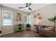 Well-lit office with hardwood floors, shelves, and stylish furnishings at 208 James St, Summerville, SC 29483