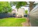 Spacious backyard features a well-maintained lawn, new deck, and a charcoal gray privacy fence at 21 America St, Charleston, SC 29403