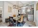 Bright dining area with modern lighting, stainless steel appliances, and access to the living area at 21 America St, Charleston, SC 29403