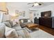 Comfortable living room with a gray sofa, wooden coffee table, and stylish decor at 21 America St, Charleston, SC 29403