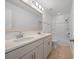 Bright bathroom with double sink vanity, large mirror, and tub with shower at 211 Saxony Loop, Summerville, SC 29486