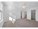 Spacious bedroom with ample natural light, ceiling fan and neutral carpet at 211 Saxony Loop, Summerville, SC 29486