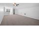 Large bonus room with neutral carpet, ceiling fan, and ample space at 211 Saxony Loop, Summerville, SC 29486