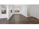 Dining area featuring wood floors, natural light, and adjacent staircase at 211 Saxony Loop, Summerville, SC 29486