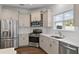 Modern kitchen featuring stainless steel appliances, white subway tile backsplash and light brown cabinets at 211 Saxony Loop, Summerville, SC 29486