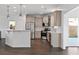 Well-lit kitchen featuring stainless steel appliances, a breakfast bar, and lots of cabinet space at 211 Saxony Loop, Summerville, SC 29486