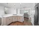 Open concept view of kitchen and living room with modern pendant lighting at 211 Saxony Loop, Summerville, SC 29486