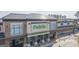 Aerial shot of a modern Publix grocery store exterior with a metal roof and brick facade at 211 Saxony Loop, Summerville, SC 29486