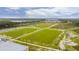 Aerial view of recreation field with green grass and trees in the background at 211 Saxony Loop, Summerville, SC 29486