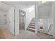 Carpeted staircase leading to the upper level, bathed in natural light from nearby windows at 211 Saxony Loop, Summerville, SC 29486