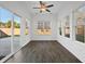 Sun room filled with natural light featuring ceiling fan, multiple windows and wood flooring at 211 Saxony Loop, Summerville, SC 29486