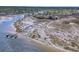 Expansive aerial view showcasing a marshland landscape with a dock, waterways and surrounding houses at 2292 Beckenham Dr, Mount Pleasant, SC 29466