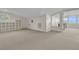 Bright attic area with shelving, carpet, and an office space, illuminated by a round window at 2292 Beckenham Dr, Mount Pleasant, SC 29466