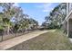 Large, fenced backyard offering plenty of space with mature trees and landscaping for outdoor enjoyment at 2292 Beckenham Dr, Mount Pleasant, SC 29466