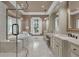 Elegant bathroom featuring a soaking tub, glass-enclosed shower, and double vanity with marble countertops at 2292 Beckenham Dr, Mount Pleasant, SC 29466