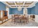 Formal dining room with beautiful wood floors, coffered ceilings, and a stylish chandelier at 2292 Beckenham Dr, Mount Pleasant, SC 29466
