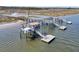 This is an aerial view of a dock with multiple slips and a covered area, providing access to the water at 2292 Beckenham Dr, Mount Pleasant, SC 29466