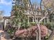 Elegant exterior of a multi-story home with mature landscaping, porch and brick accents at 2292 Beckenham Dr, Mount Pleasant, SC 29466