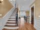 Elegant foyer showcasing hardwood floors, staircase with decorative iron railing, and scenic water views at 2292 Beckenham Dr, Mount Pleasant, SC 29466