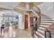 Stunning foyer with a curved staircase, tile flooring, and an open view to the living room at 2292 Beckenham Dr, Mount Pleasant, SC 29466
