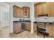 The kitchen features custom cabinets, granite countertops, and a wine refrigerator at 2292 Beckenham Dr, Mount Pleasant, SC 29466