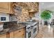 The kitchen features a stone range hood, stainless steel appliances and custom cabinets at 2292 Beckenham Dr, Mount Pleasant, SC 29466