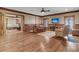 Inviting living room with hardwood floors, wood trim, a ceiling fan, and an adjacent sitting area at 2292 Beckenham Dr, Mount Pleasant, SC 29466
