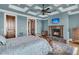 Main bedroom boasts a fireplace, coffered ceiling, TV, and hardwood floors at 2292 Beckenham Dr, Mount Pleasant, SC 29466