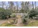 Lush backyard garden featuring a brick pathway and beautiful landscaping at 235 Scalybark Rd, Summerville, SC 29485