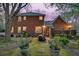 Picturesque backyard with brick home exterior, well-manicured lawn, and mature trees at 235 Scalybark Rd, Summerville, SC 29485
