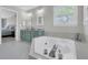 Bright bathroom featuring a soaking tub, double vanity, and neutral color palette at 235 Scalybark Rd, Summerville, SC 29485