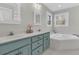 Bright bathroom featuring a soaking tub, double vanity, and neutral color palette at 235 Scalybark Rd, Summerville, SC 29485
