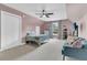 Spacious carpeted bedroom features large window, ceiling fan, and sloped ceilings at 235 Scalybark Rd, Summerville, SC 29485