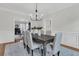 Dining room featuring modern light fixture, wainscoting, and neutral color palette at 235 Scalybark Rd, Summerville, SC 29485