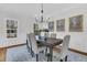 Dining room showcasing natural light, modern light fixture and elegant decor at 235 Scalybark Rd, Summerville, SC 29485