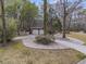 Long driveway leading to a two-car garage with a white picket fence at 235 Scalybark Rd, Summerville, SC 29485
