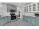 Updated kitchen featuring stainless steel appliances, gray cabinets, and black and white patterned flooring at 235 Scalybark Rd, Summerville, SC 29485