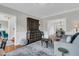 Spacious living area boasts hardwood floors, a cozy rug, and stylish decor at 235 Scalybark Rd, Summerville, SC 29485