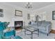 Inviting living room with a cozy fireplace, plush seating, and elegant decor at 235 Scalybark Rd, Summerville, SC 29485