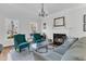 Elegant living room features a fireplace, chandelier, hardwood floors, and comfortable seating at 235 Scalybark Rd, Summerville, SC 29485