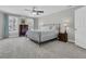 Large bedroom features a ceiling fan, windows with curtains, and a spacious closet at 235 Scalybark Rd, Summerville, SC 29485