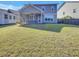 Large, grassy backyard with a screened-in patio and a shed at 253 Palmetto Walk Dr, Summerville, SC 29486